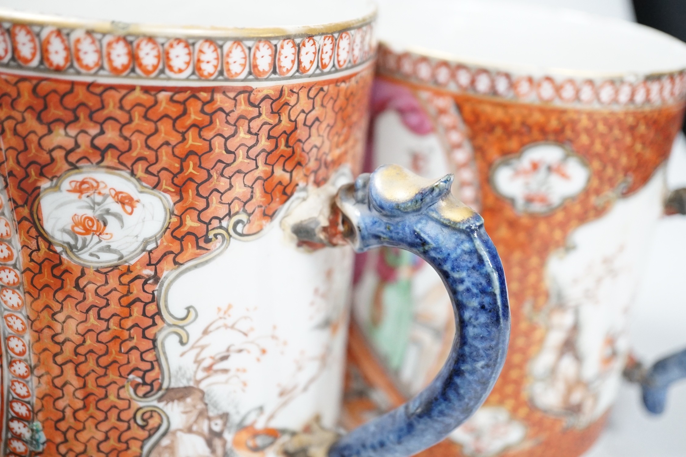 Two Chinese export 'mandarin' mugs and a similar teapot, Qianlong period, tallest mug 14cms high